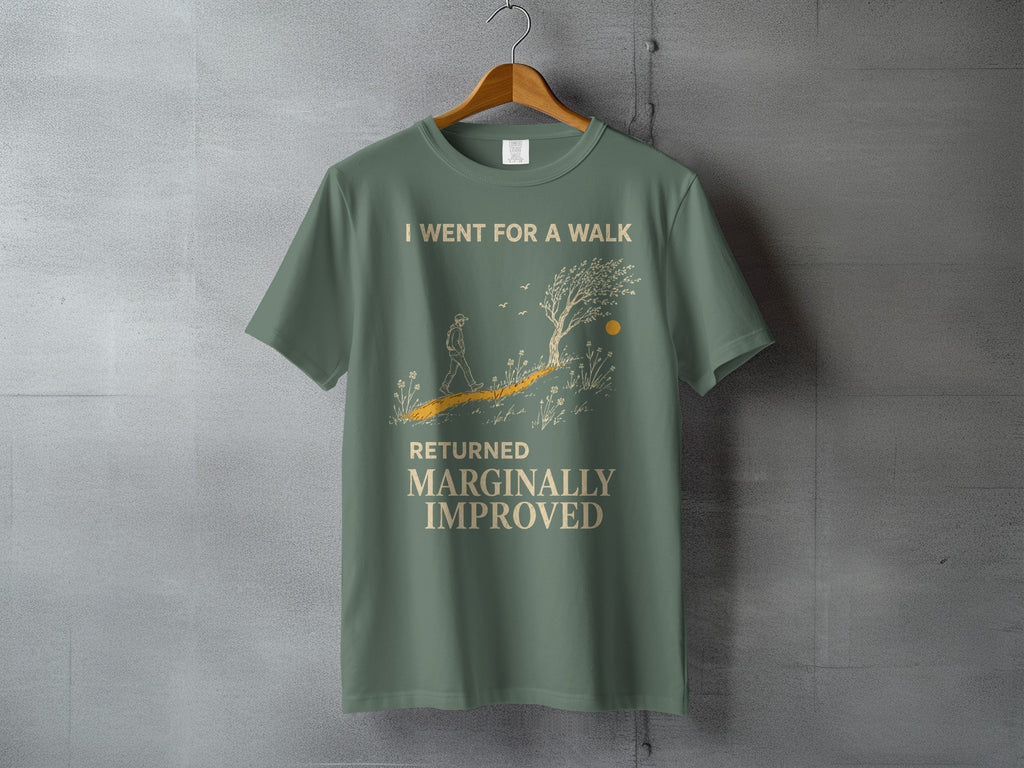 Green t-shirt with graphic of a person walking on a path, text reads "I WENT FOR A WALK RETURNED MARGINALLY IMPROVED".