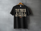 Black t-shirt with text "THE TREES HAVE NO ACTION ITEMS".
