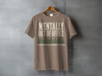 Brown t-shirt with "MENTALLY OUT OF OFFICE" and trees graphic.
