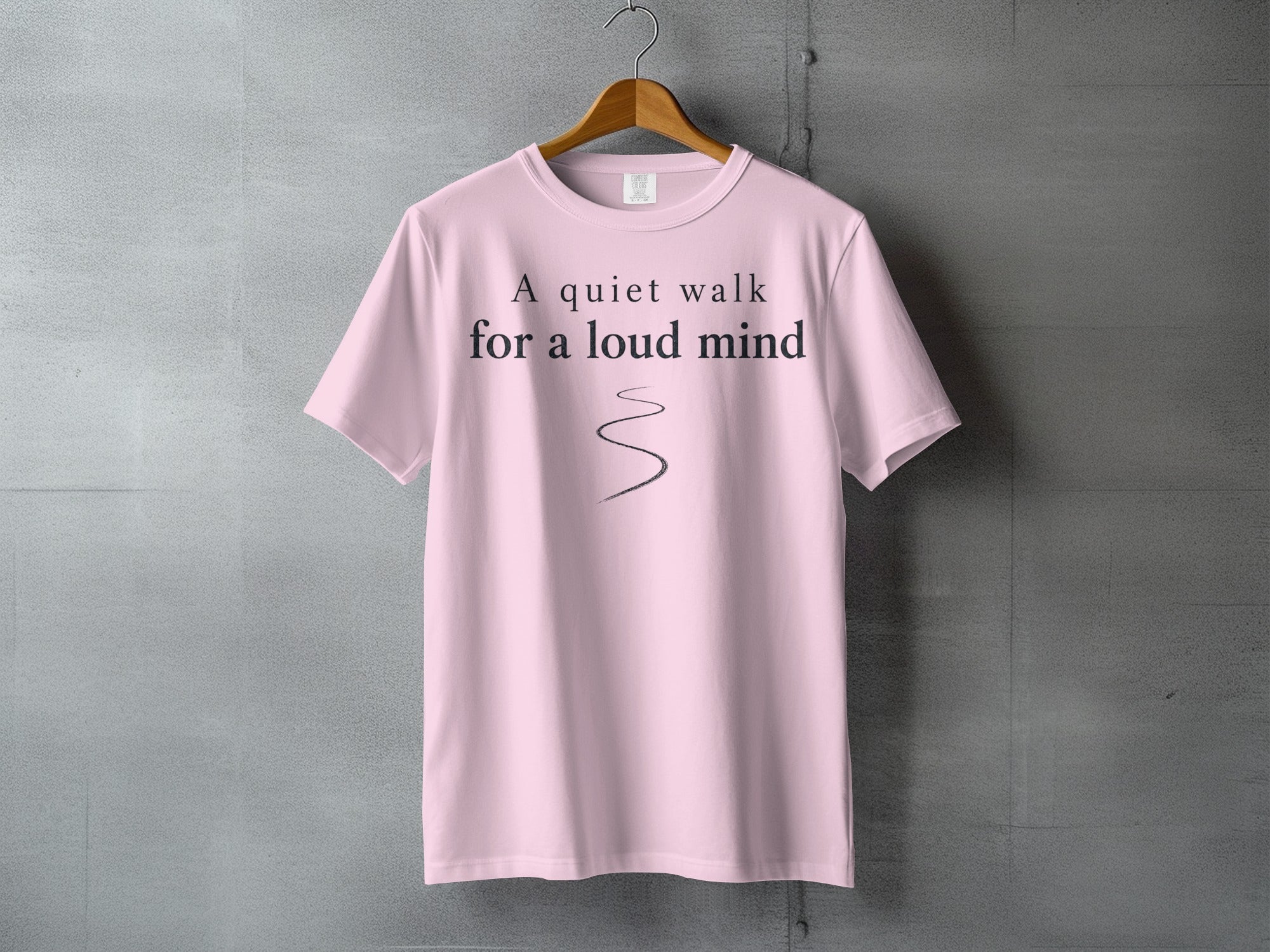 Light pink t-shirt with "A quiet walk for a loud mind" text.