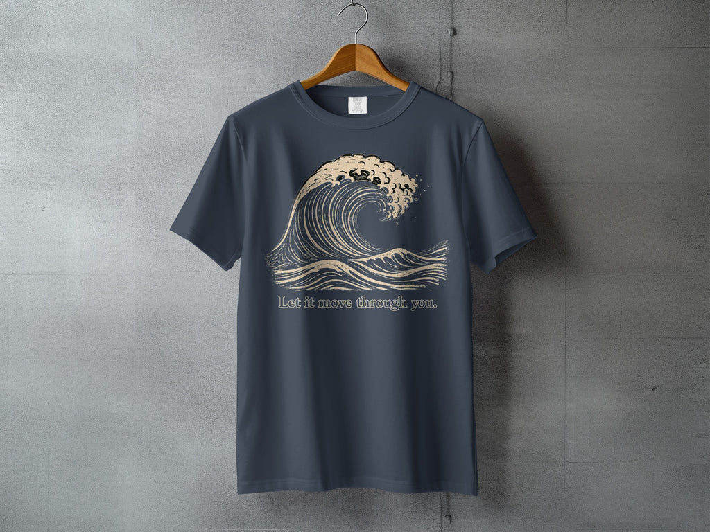 Dark blue t-shirt with a beige wave graphic and text "Let it move through you."