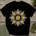 Black t-shirt with a circular mandala design featuring fig-like shapes and a spiral.