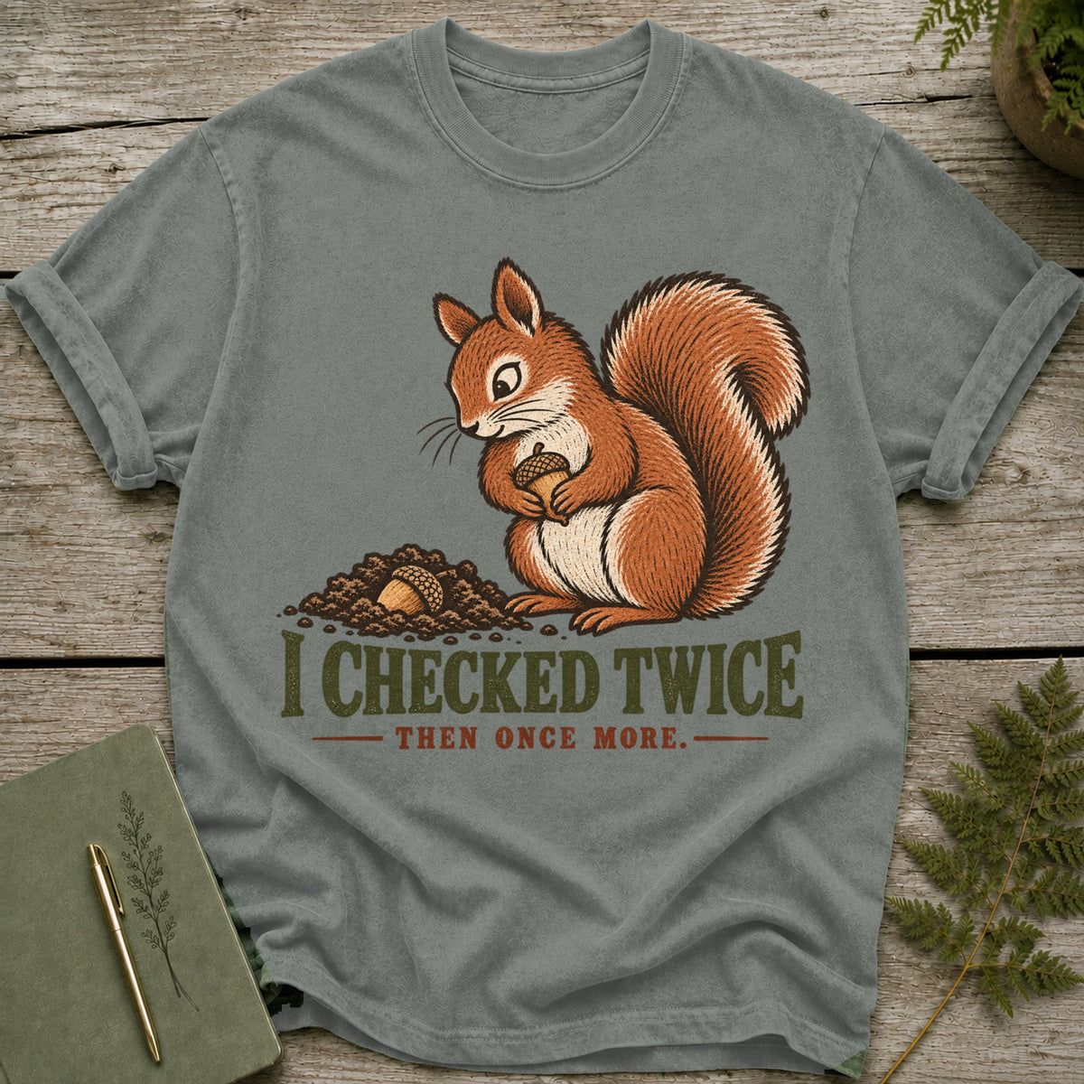 Grey t-shirt with a squirrel holding an acorn and text "I CHECKED TWICE THEN ONCE MORE."