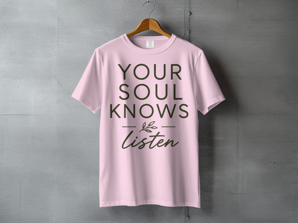 Pink t-shirt with "YOUR SOUL KNOWS Listen" text and a small leaf illustration.