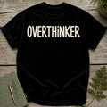 Black t-shirt with "OVERTHINKER" in distressed cream text.