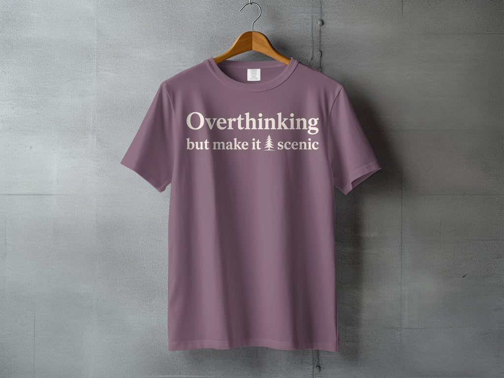 Dusty rose t-shirt with "Overthinking but make it scenic" text and a tree graphic.