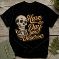 Black t-shirt with skeleton graphic and text "Have the Day you Deserve".