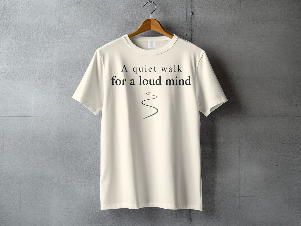 Cream t-shirt with "A quiet walk for a loud mind" text and wavy line.