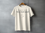 Cream t-shirt with "A quiet walk for a loud mind" text and wavy line.