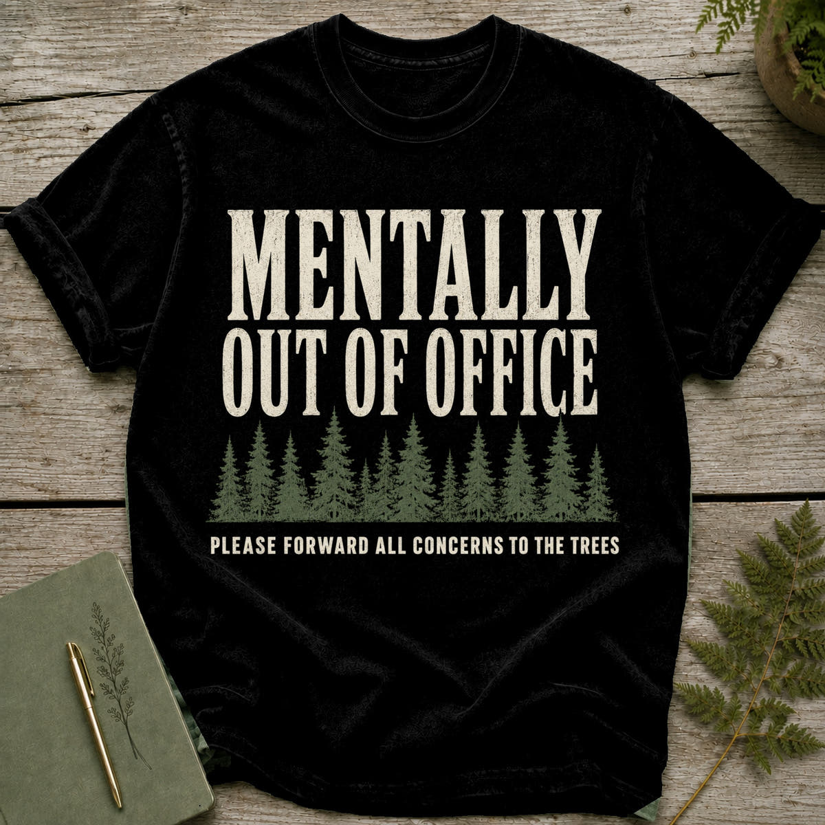 Black t-shirt with text "MENTALLY OUT OF OFFICE" and trees.
