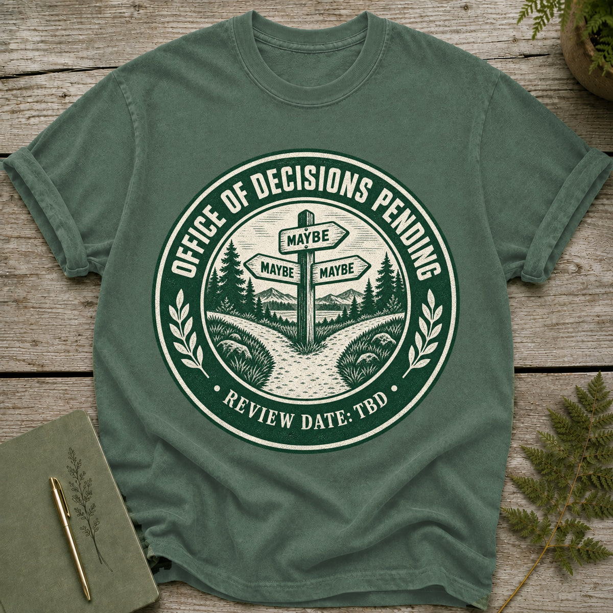 Green t-shirt with "Office of Decisions Pending" graphic and "Review Date: TBD".
