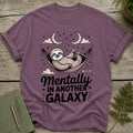 Purple t-shirt with a sloth in a hammock and text "Mentally In Another Galaxy".