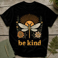 Black t-shirt with "be kind" text, a dragonfly, and floral designs.