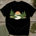 Black t-shirt with a forest scene: sunrise, trees, and a winding road.