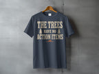 Dark gray t-shirt with text "THE TREES HAVE NO ACTION ITEMS"