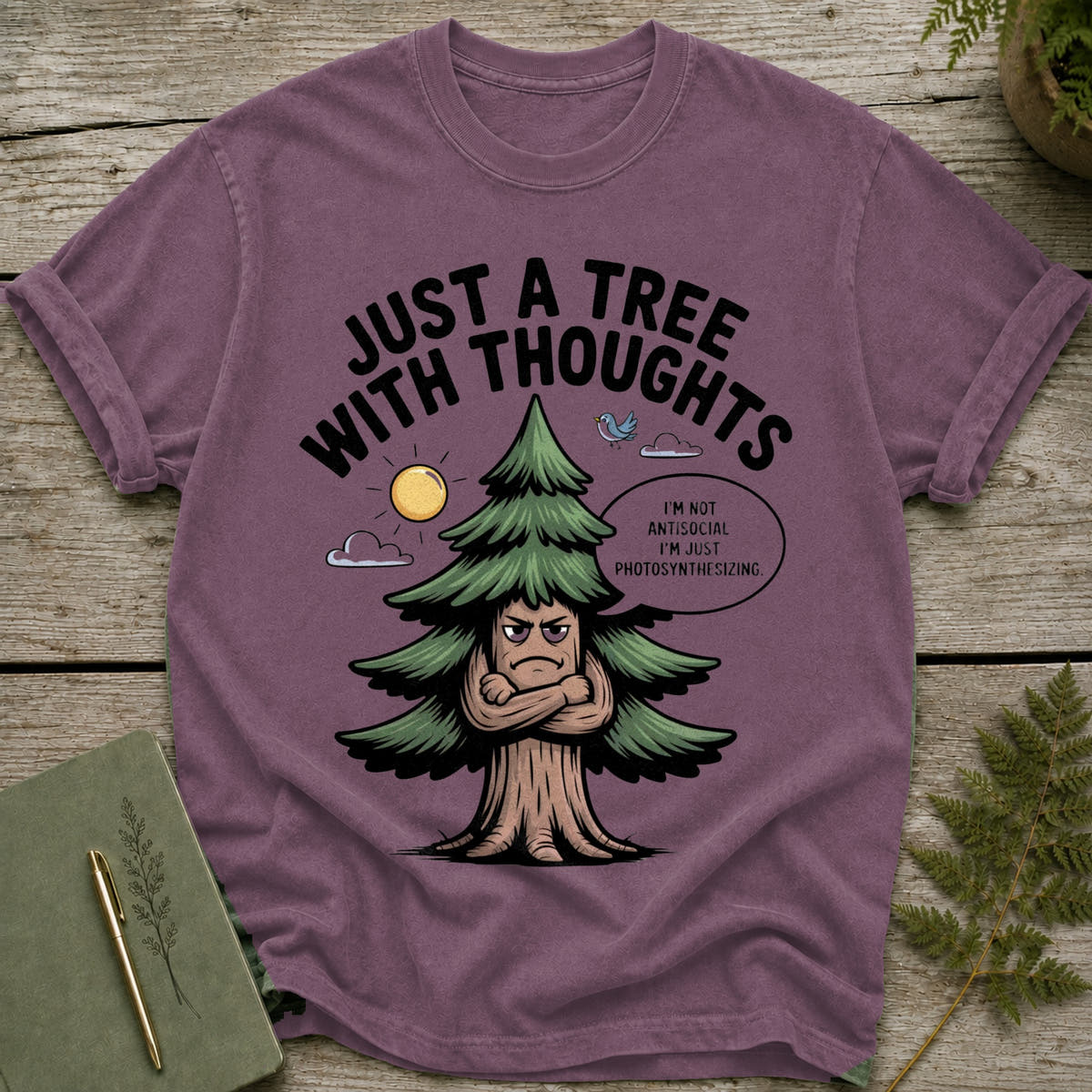 T-shirt with a cartoon tree that says "Just a tree with thoughts."