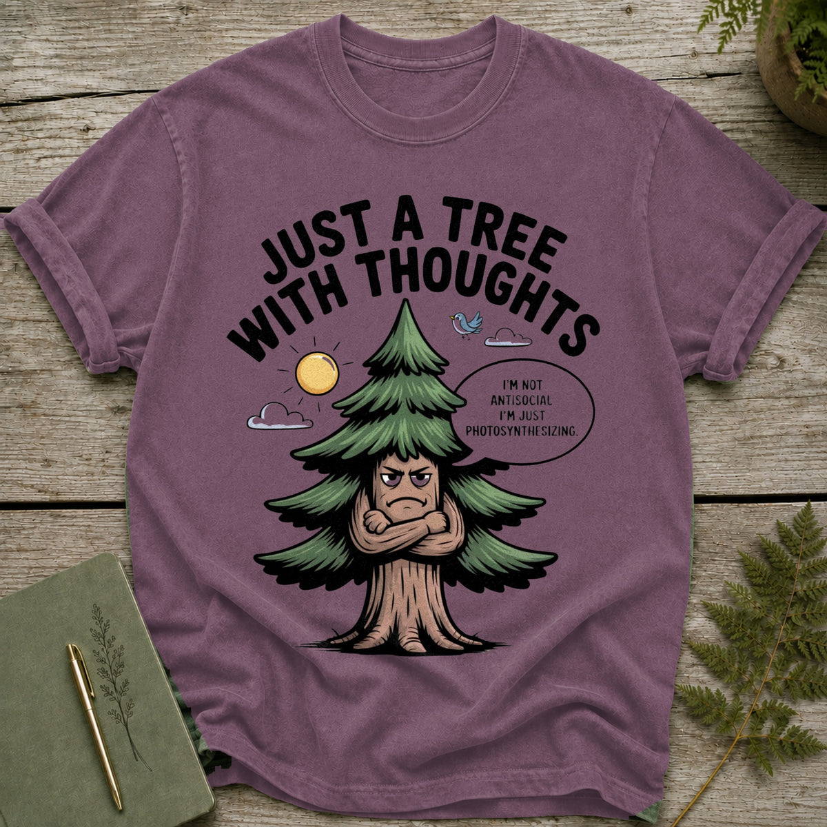 T-shirt with a cartoon tree that says "Just a tree with thoughts."
