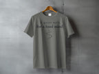 Gray t-shirt with "A quiet walk for a loud mind" text and a curved line.